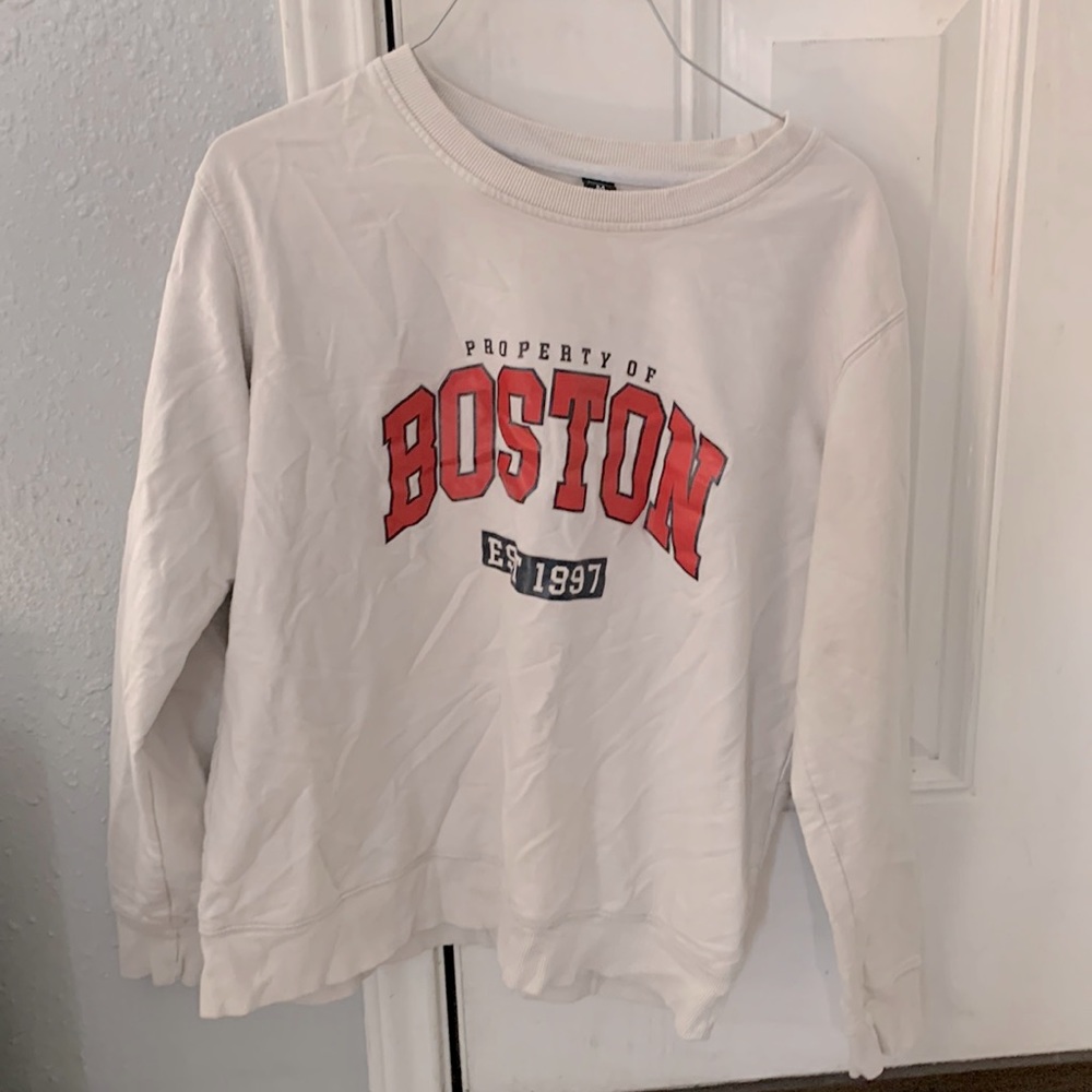 Medium red lettered “Boston” on white size 38 even says it on the shirt